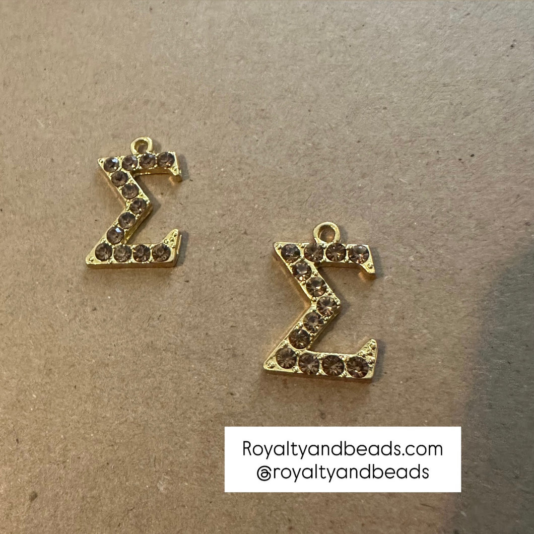 Gold Sigma charm.