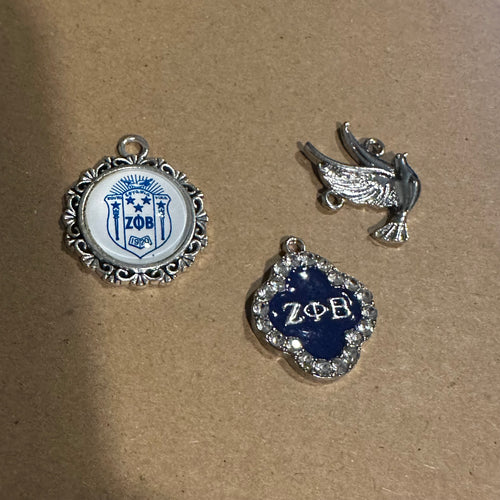 3 silver Zeta charms