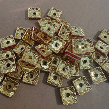 Load image into Gallery viewer, 25 red and gold rondelle spacers.