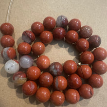 Load image into Gallery viewer, Orange and gray beads.