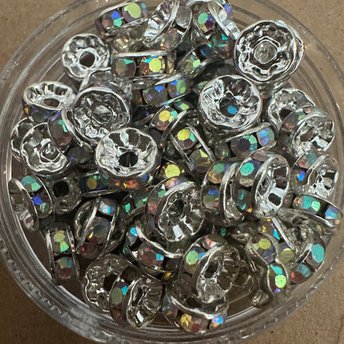 50 clear and silver rondelle spacers.