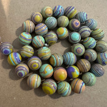 Load image into Gallery viewer, Yellow and purple swirl beads