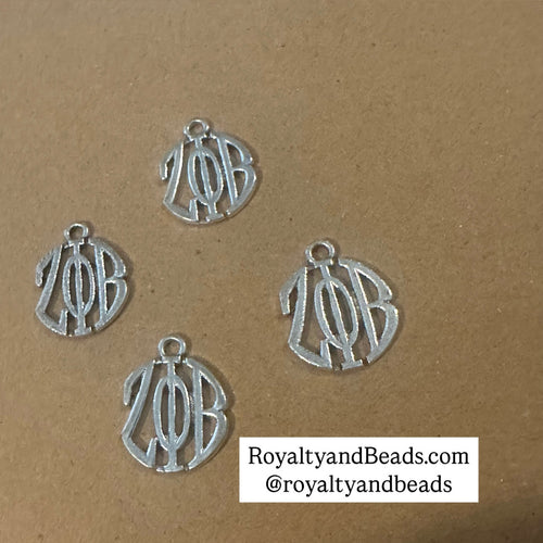 4 silver Zeta charms