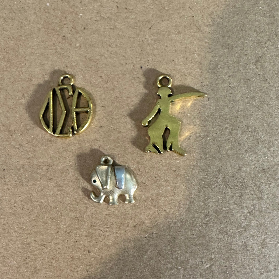 3 gold Delta charms*