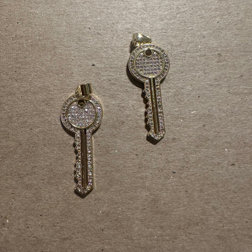 Pave gold key charm.