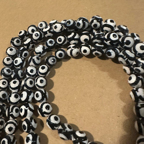 Tan and black circle beads.