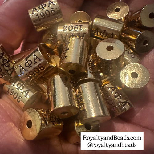 Alpha Phi Alpha 1906 cylinder charms