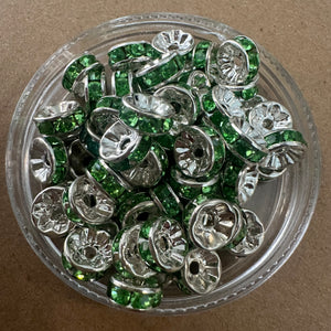 50 green and silver rondelle spacers.