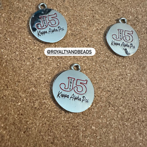 Silver J5 Kappa charm.