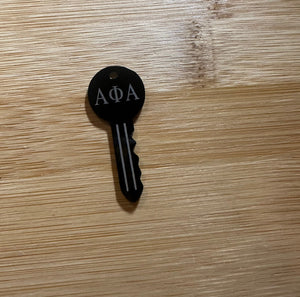 Black Alpha key charms