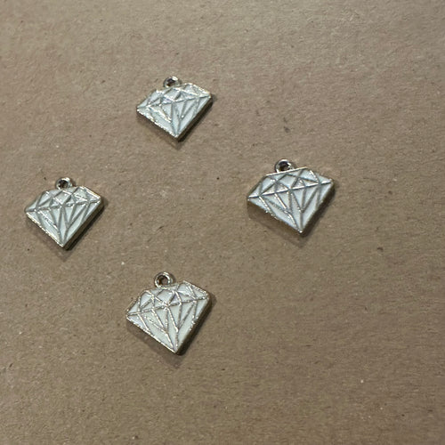 Gold and white diamond charm.