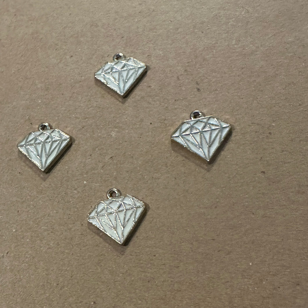 Gold and white diamond charm.