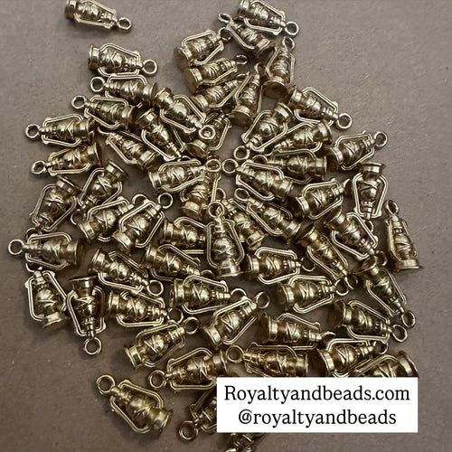 Gold Omega lamp charm