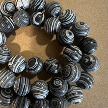 Load image into Gallery viewer, Black and white swirl beads.