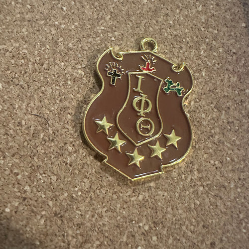 Iota Phi Theta charm (Gold).