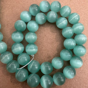 Sea blue cats eye beads.