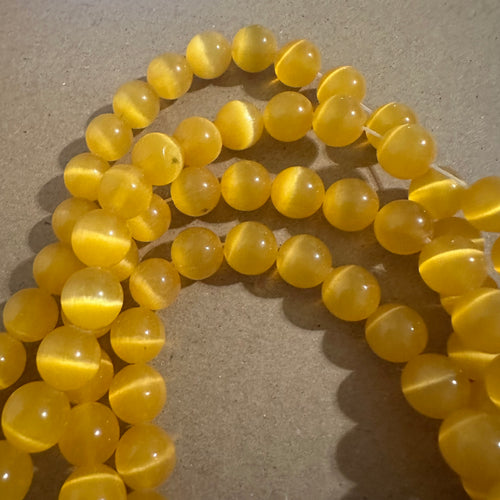 Yellow cats eye beads.