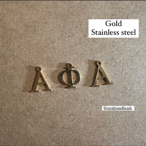 3 gold Alpha letters