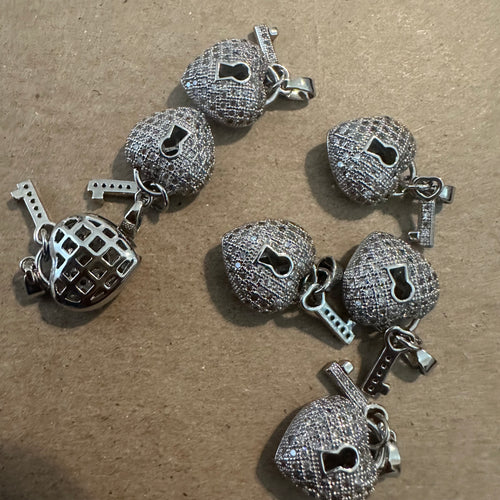 Pave heart lock charms.