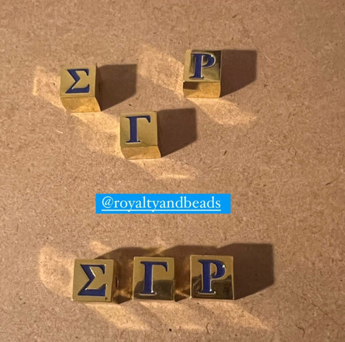 Blue and gold letter cubes (SGRho).