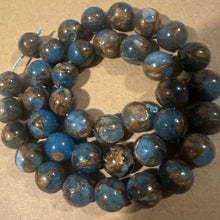 Load image into Gallery viewer, Light blue and gold beads.