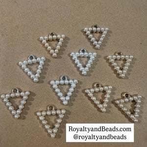 3 pyramid charms.