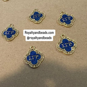 Gold Sigma 4 way charms.