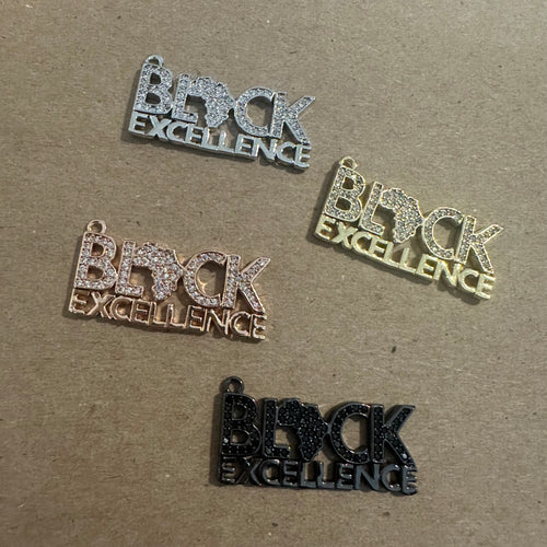 Pave black excellence charm.