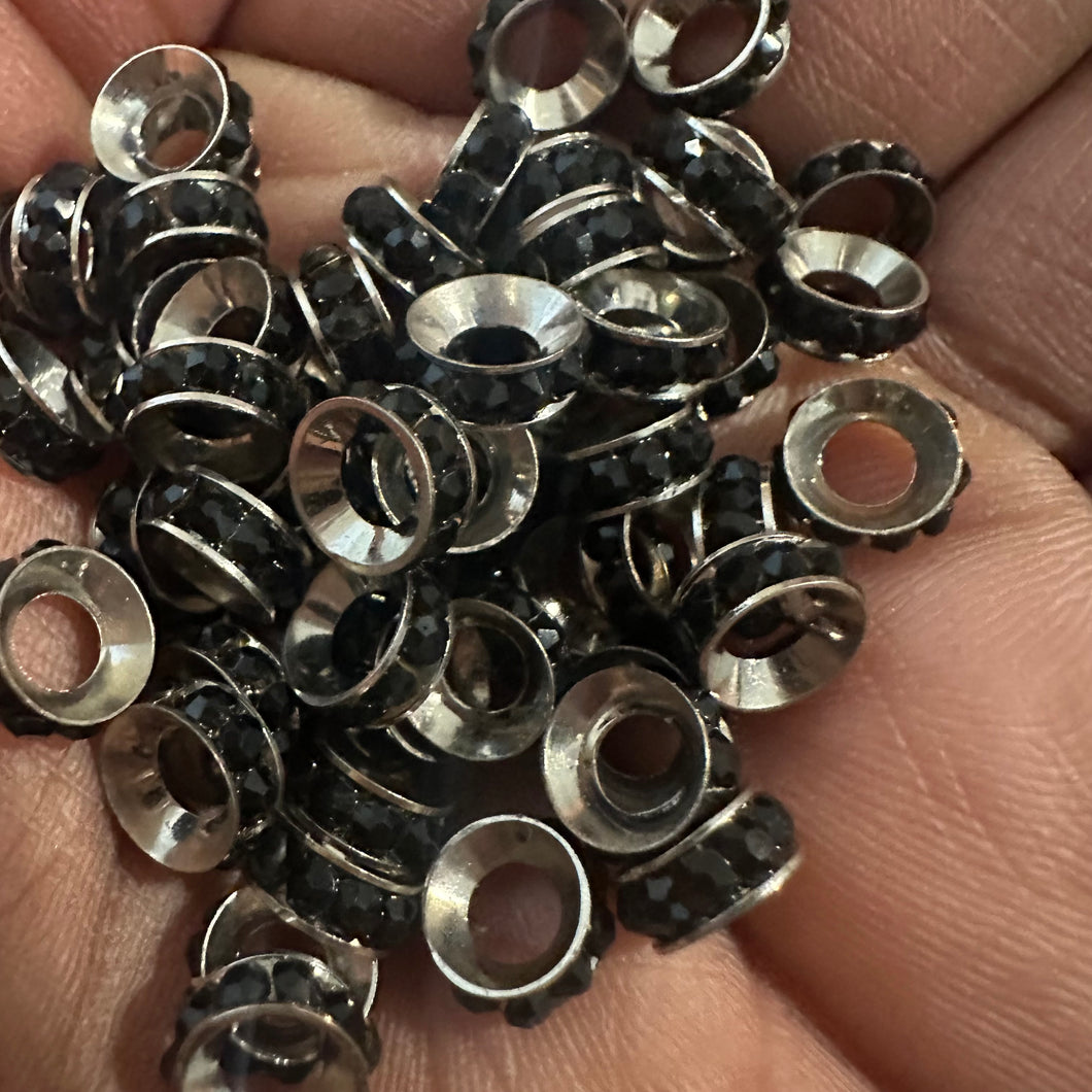 50 black and silver rondelle spacers.