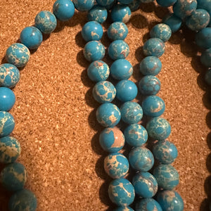 Blue and tan beads 8mm.