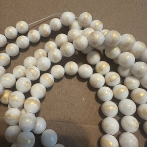 White and gold beads.