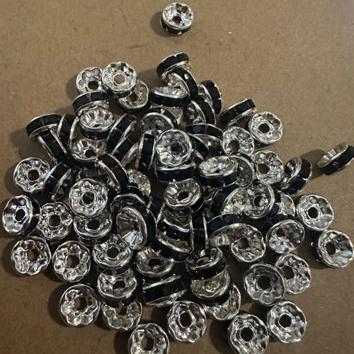 50 black and silver rondelle spacers.