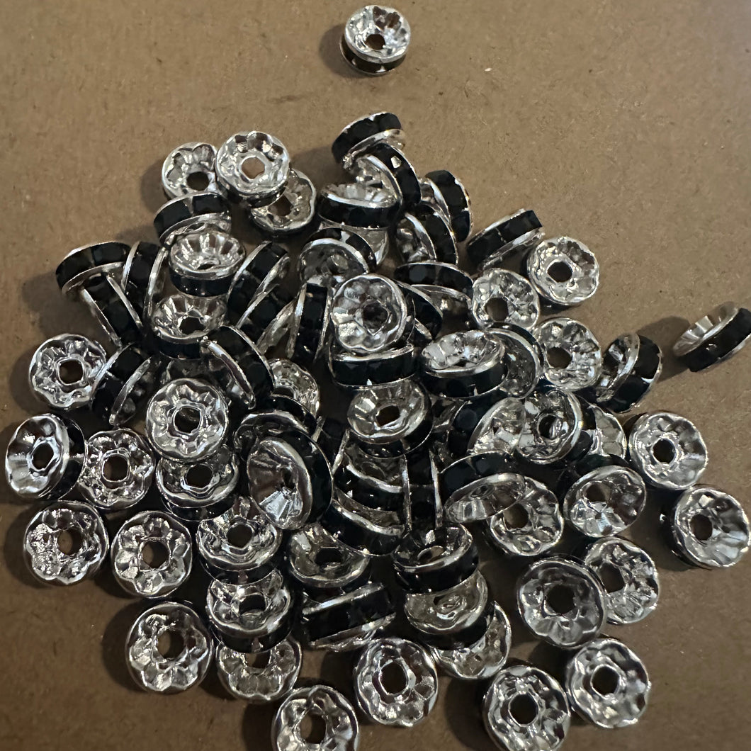 50 black and silver rondelle spacers.