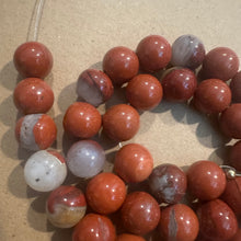 Load image into Gallery viewer, Orange and gray beads.