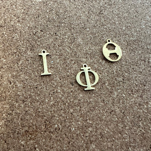 3 gold Iota letters