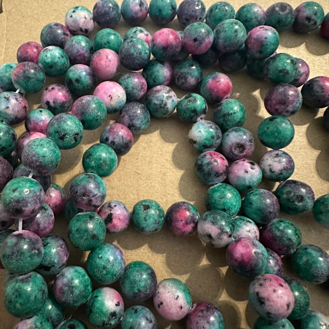 Pink green and black beads