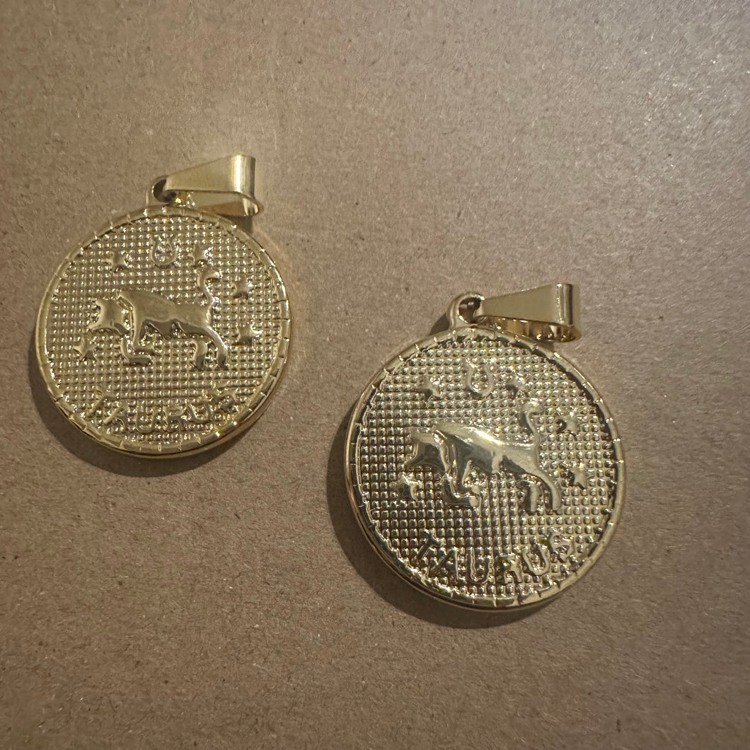2 Taurus charms (gold)