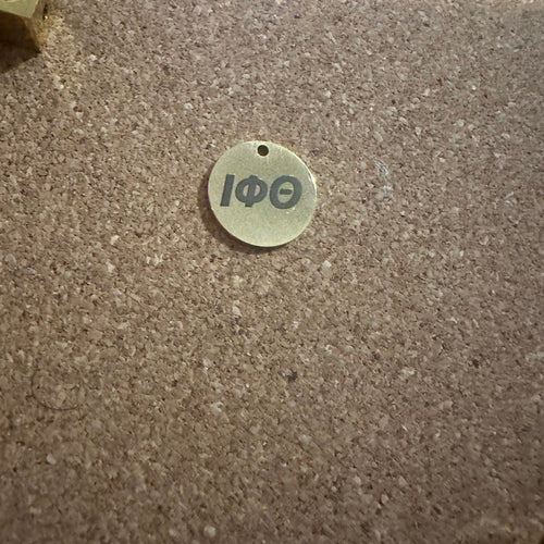 Iota Phi Theta charm.