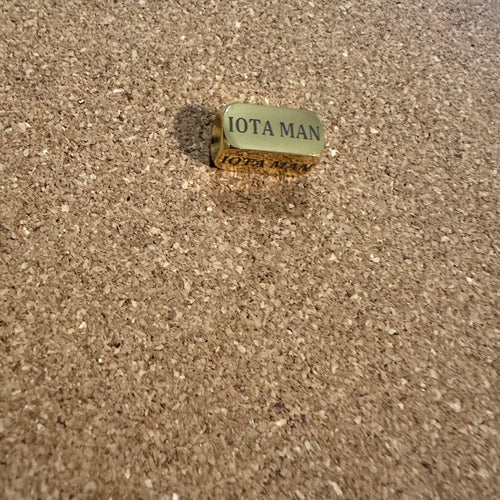 Iota man block charm.