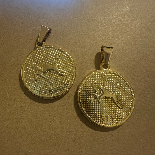 2 Aries charms (gold)