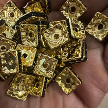 Load image into Gallery viewer, 25 black and gold rondelle spacers.