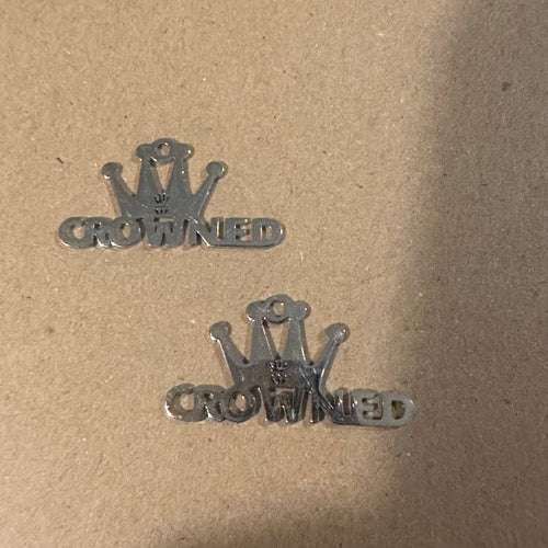 2 silver “crowned” charms