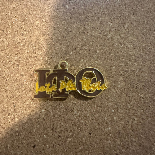 Iota Phi Theta charm.