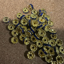 Load image into Gallery viewer, 50 blue and gold rondelle spacers.