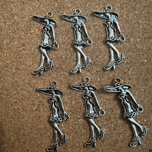 6 silver woman charms.