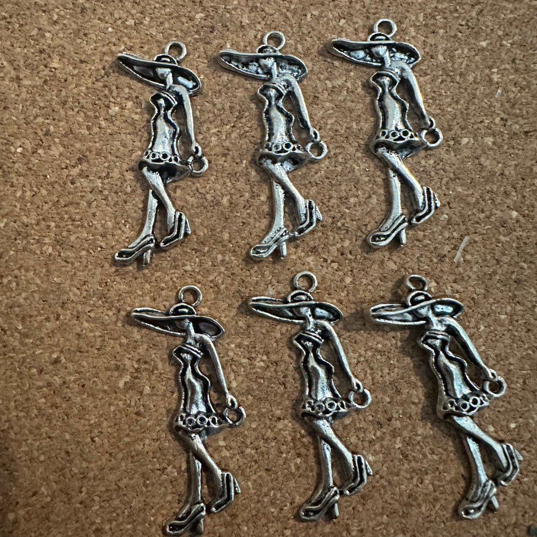 6 silver woman charms.