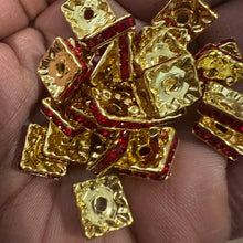 Load image into Gallery viewer, 25 red and gold rondelle spacers.