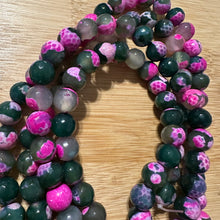 Load image into Gallery viewer, Pink and green beads.