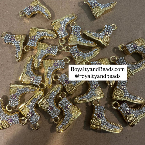 Gold Omega boot charm.
