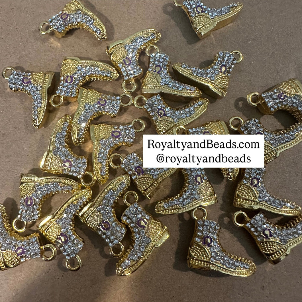 Gold Omega boot charm.